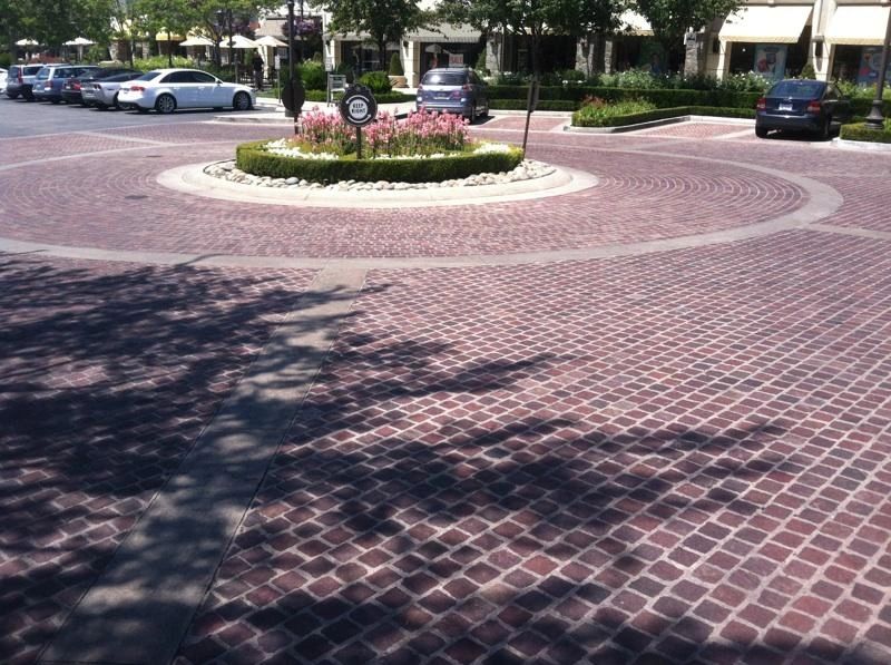 Red Mexican Porphyry 4x4 pavers — Southern California parking lot